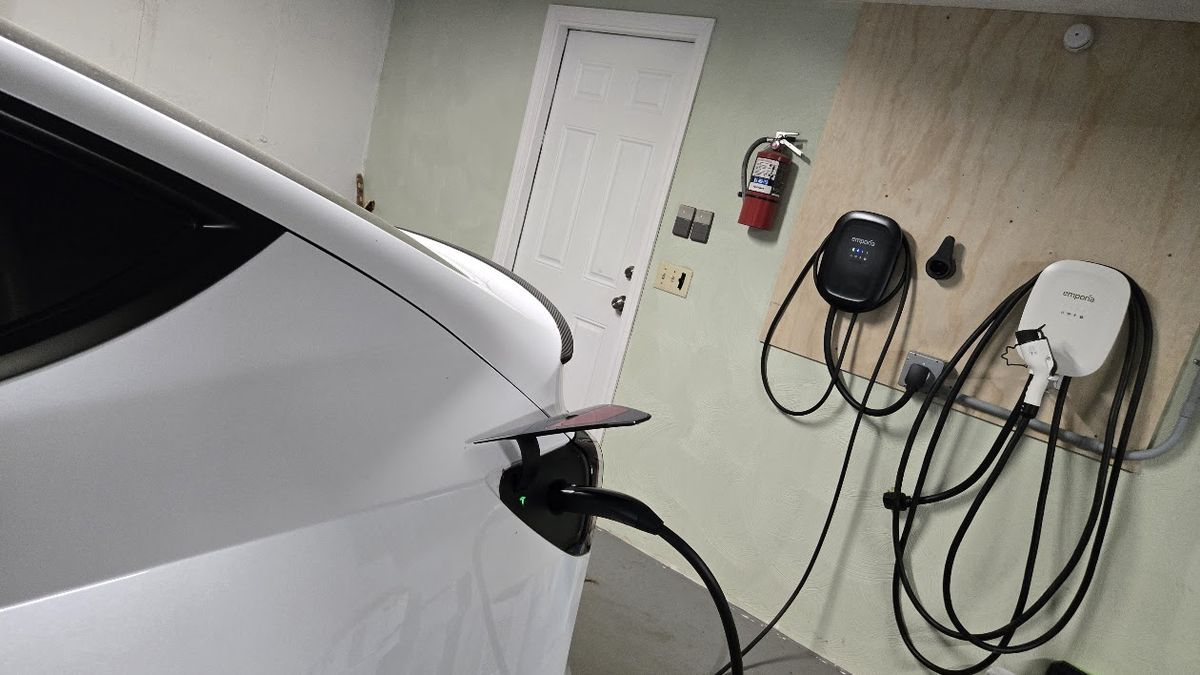 A 2022 Tesla Model Y Performance undergoes battery testing while connected to an Emporia Level 2 charger